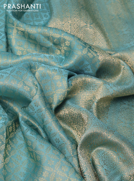 Banarasi semi crepe saree teal blue shade with allover zari woven brocade weaves and lace work border