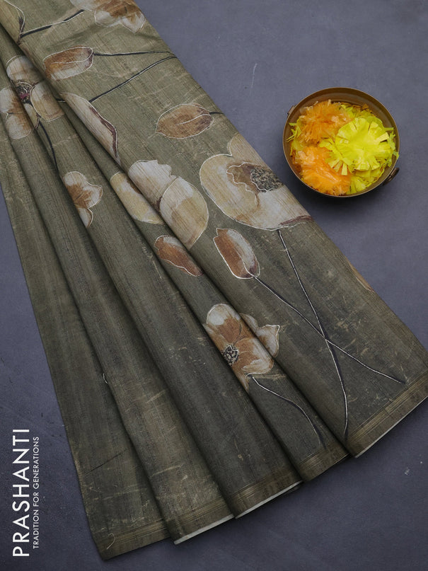 Semi tussar saree sap green shade with floral prints and simple zari border