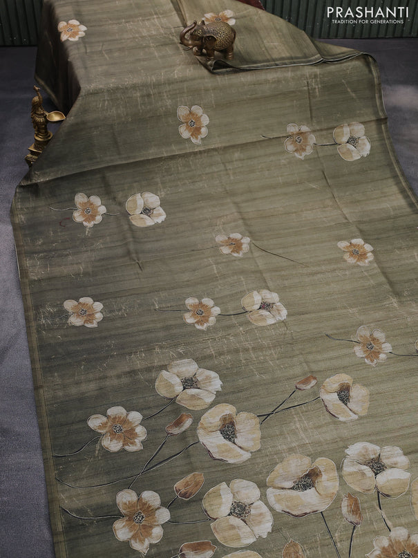 Semi tussar saree sap green shade with floral prints and simple zari border