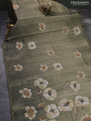 Semi tussar saree sap green shade with floral prints and simple zari border