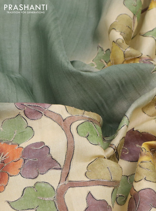 Semi tussar saree sap green shade and cream with plain body and kalamkari prints & pita work border