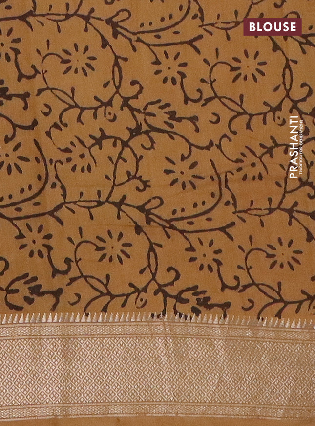 Semi chanderi saree sandal and pale orange with allover vanaspathi prints and zari woven border