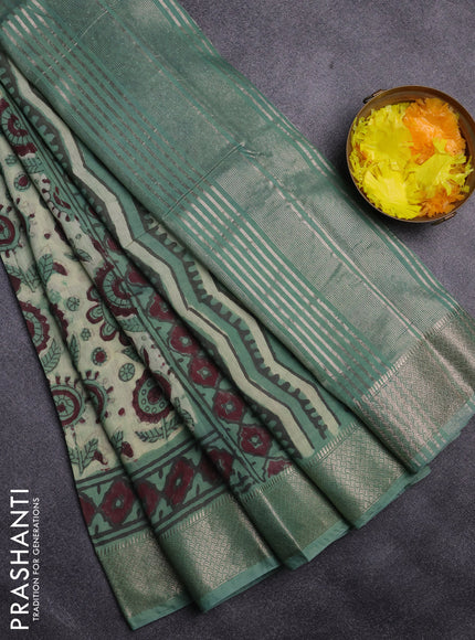 Semi chanderi saree pista green and teal shade with allover vanaspathi prints and zari woven border