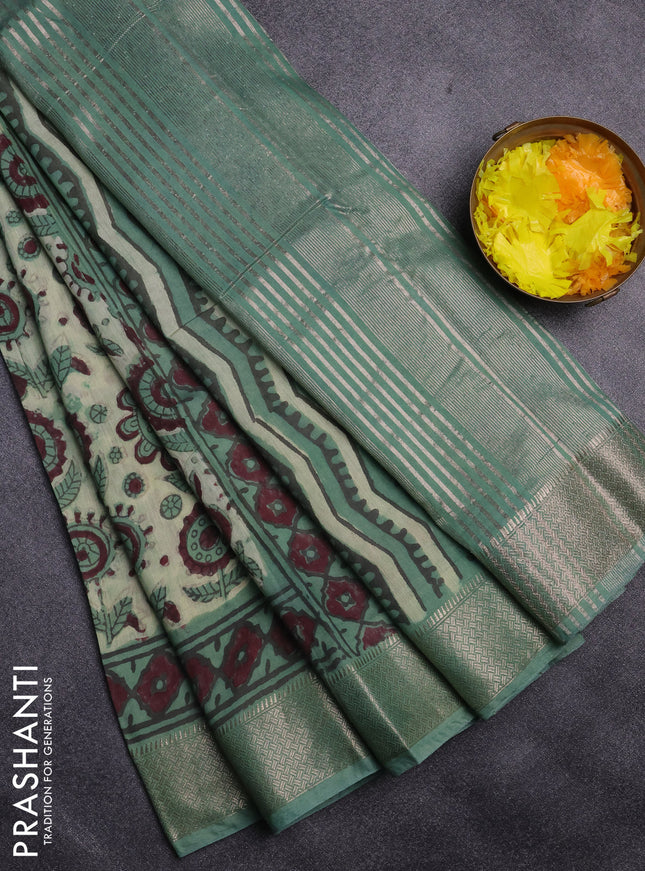 Semi chanderi saree pista green and teal shade with allover vanaspathi prints and zari woven border