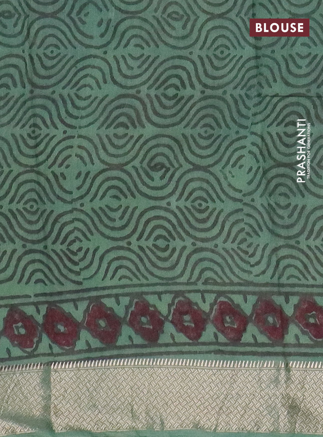 Semi chanderi saree pista green and teal shade with allover vanaspathi prints and zari woven border