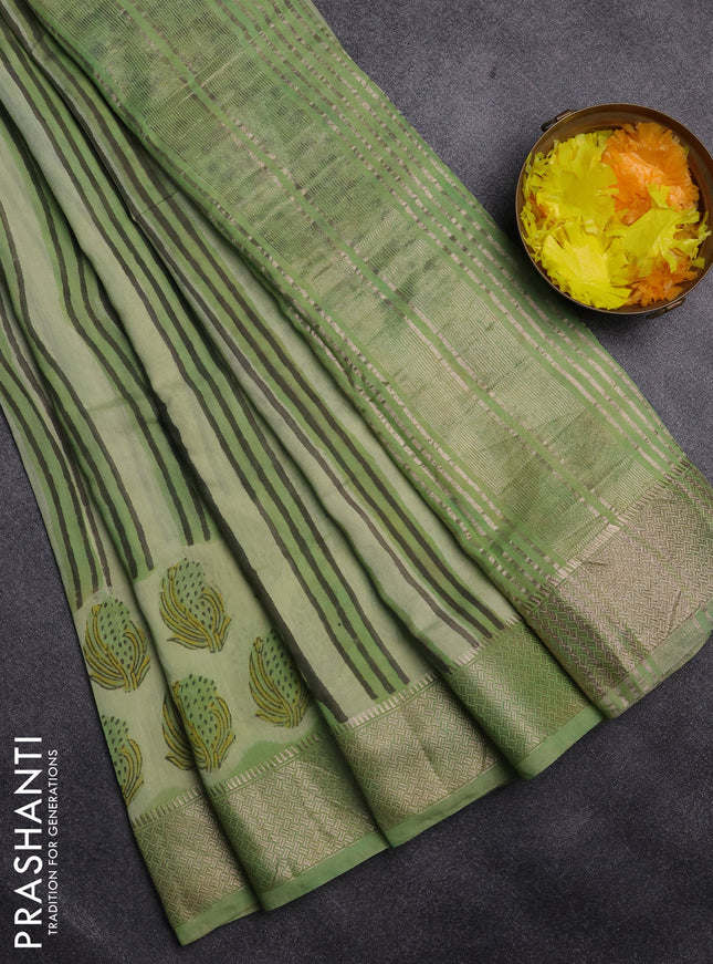 Semi chanderi saree pista green and light green with allover stripes pattern and zari woven border