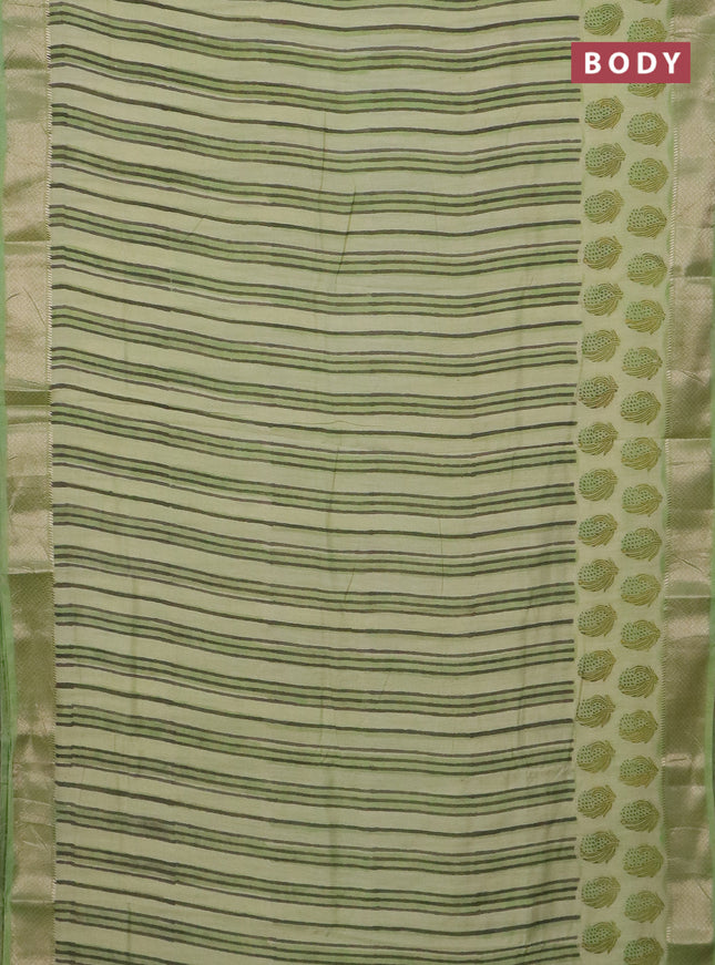 Semi chanderi saree pista green and light green with allover stripes pattern and zari woven border