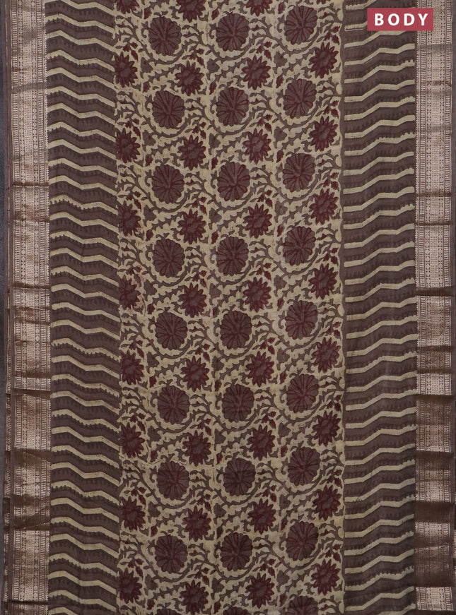 Semi chanderi saree beige and brown shade with allover vanaspathi prints and zari woven border