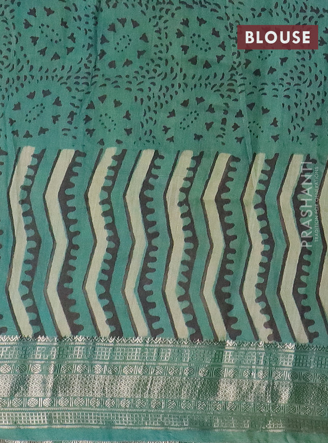 Semi chanderi saree pista green and teal shade with allover vanaspathi prints and zari woven border