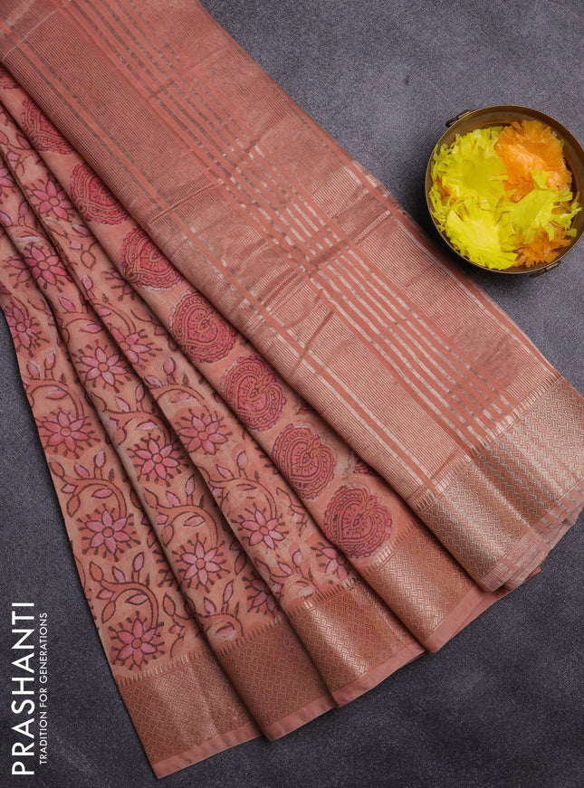 Semi chanderi saree peach orange with allover vanaspathi prints and zari woven border