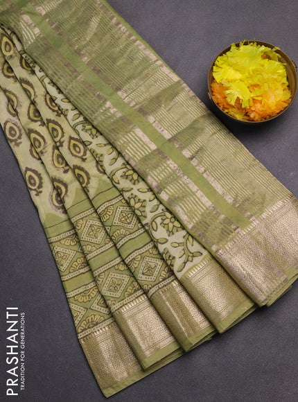 Semi chanderi saree pista green with allover vanaspathi prints and zari woven border