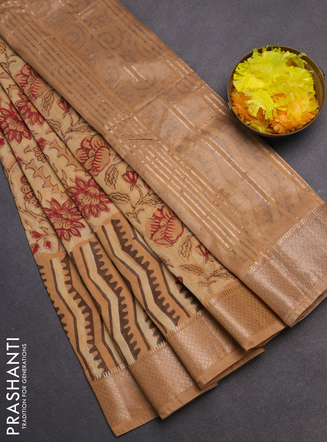 Semi chanderi saree sandal and pale orange with allover vanaspathi prints and zari woven border