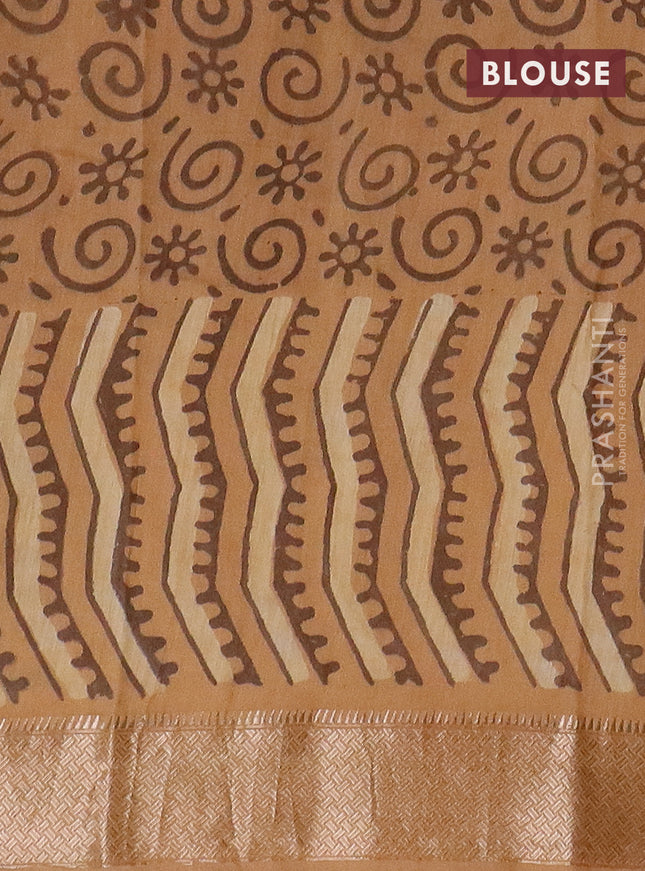 Semi chanderi saree sandal and pale orange with allover vanaspathi prints and zari woven border