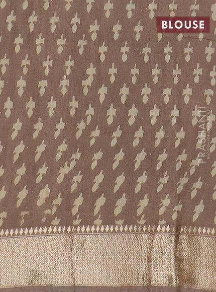 Semi chanderi saree beige and pastel brown shade with allover vanaspathi prints and zari woven border