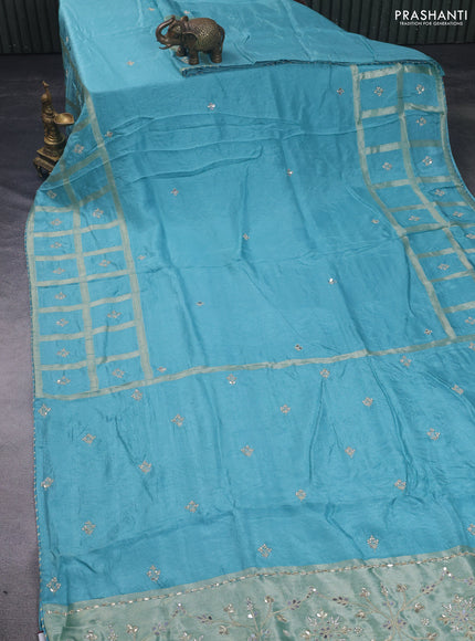 Satin crepe saree teal blue shade with embroidery work buttas and gottapatti work pallu