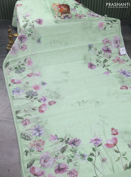 Linen cotton saree pastel green with plain body and floral prints & french knot work