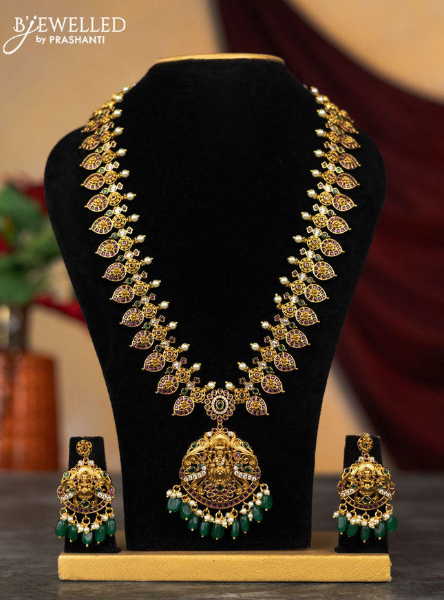 Antique haram lakshmi design with kemp & cz stones and pearl & green beads hangings