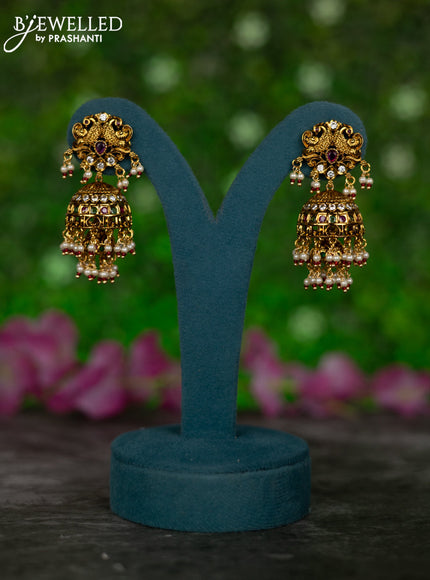 Antique double layer jhumkas peacock design with kemp & cz stones and pearl hangings