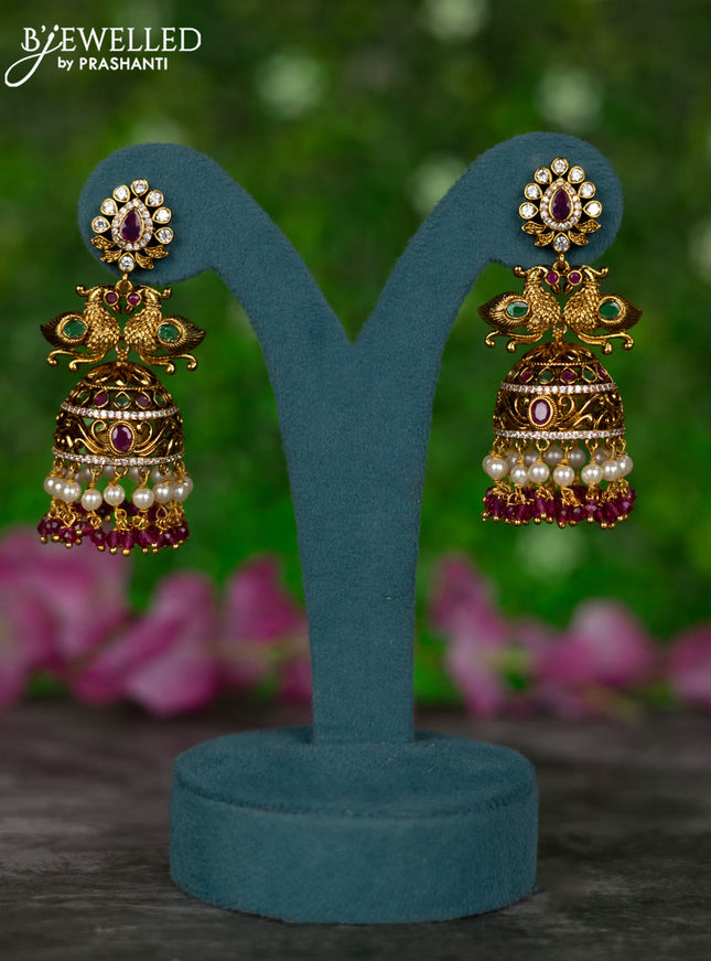 Antique jhumkas peacock design with kemp & cz stones and pearl & pink beads hangings