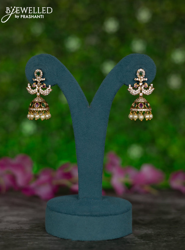 Antique jhumkas peacock design with kemp & cz stones and pearl hangings
