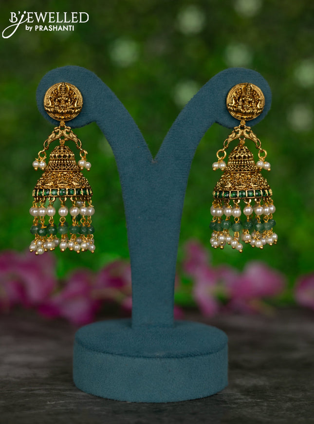 Antique jhumkas lakshmi design with green kemp & cz stones and pearl & green beads hangings