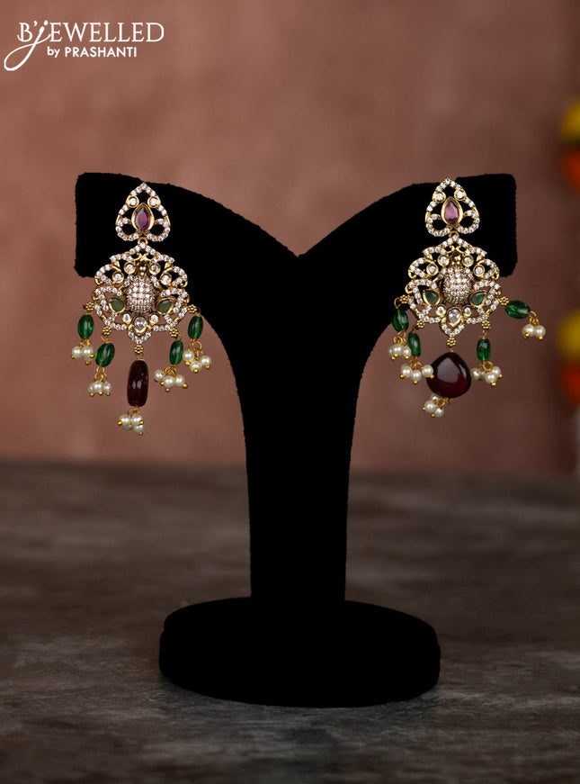 Beaded multilayer green red necklace lakshmi & ganesha pendant with emerald kundan & cz stones and pearl hangings in victorian finish