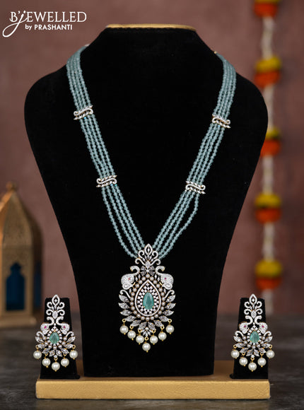 Beaded mint green necklace with cz stones and pearl hangings in zircon finish