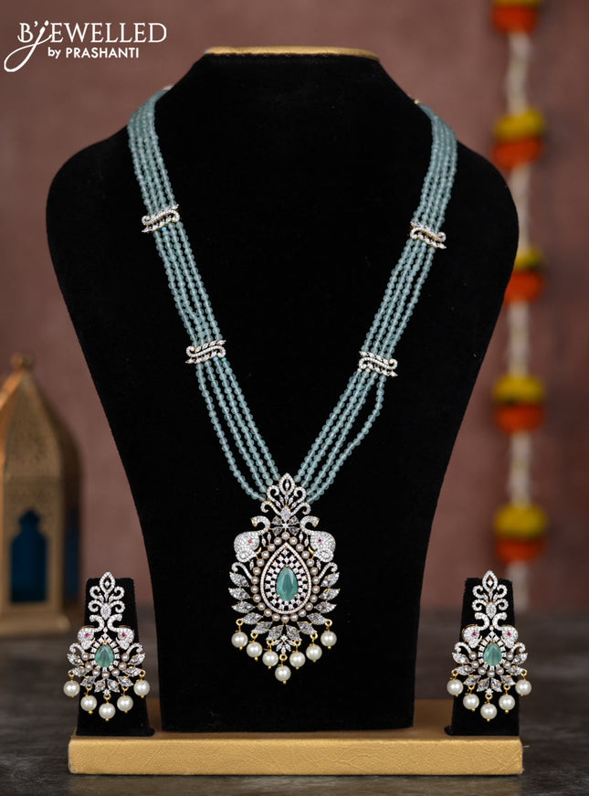 Beaded mint green necklace with cz stones and pearl hangings in zircon finish