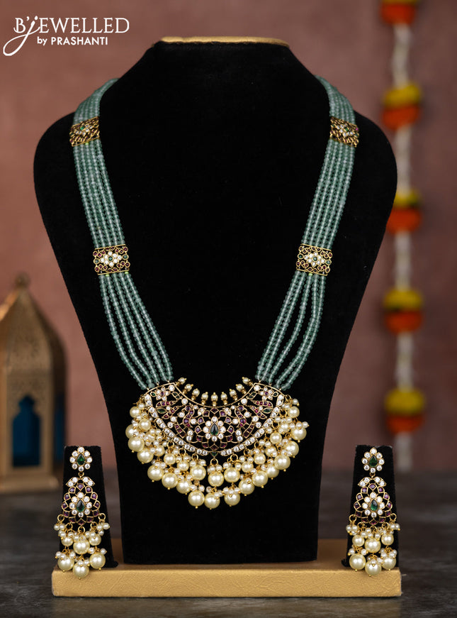 Beaded multilayer mint green necklace with kemp & cz stones and pearl hangings in victorian finish
