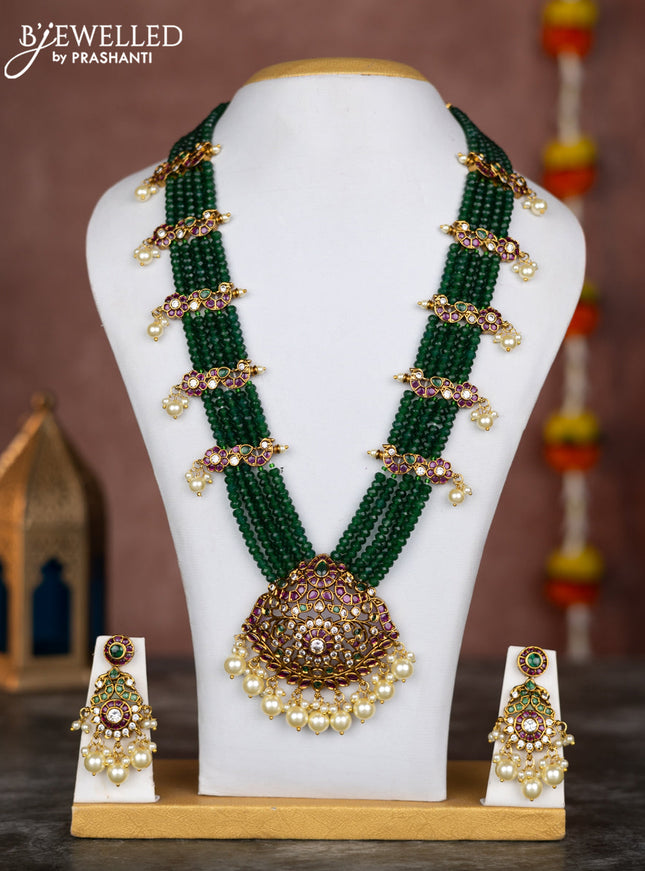Beaded multilayer green necklace with kemp & cz stones and pearl hangings in victorian finish