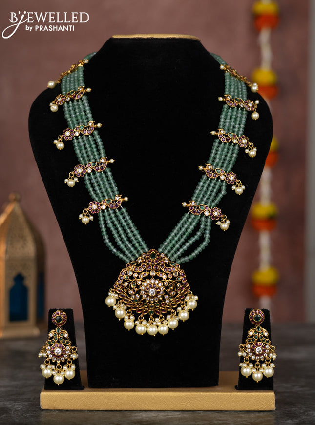 Beaded multilayer mint green necklace with kemp & cz stones and pearl hangings in victorian finish
