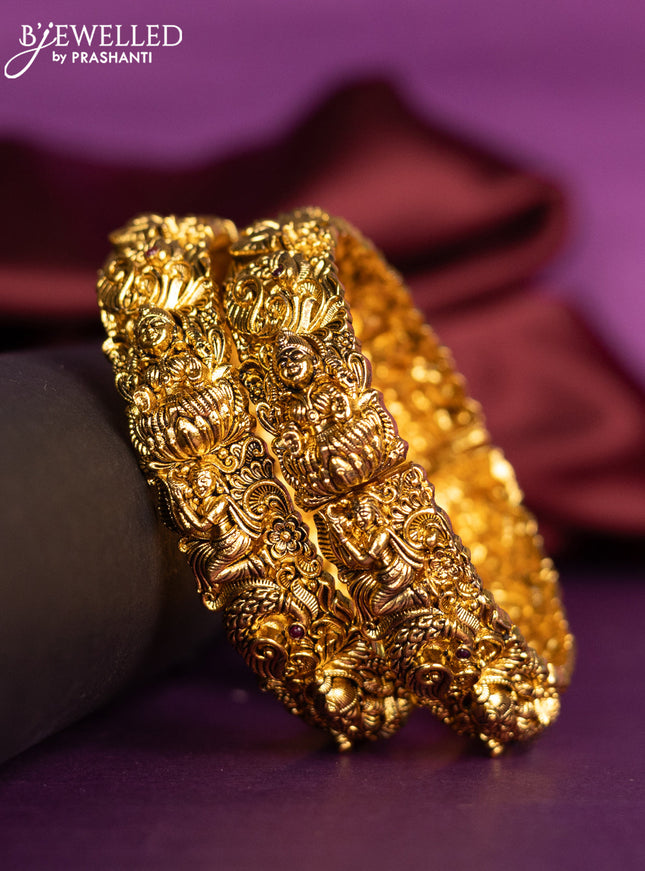Antique bangles with lakshmi design and ruby stones