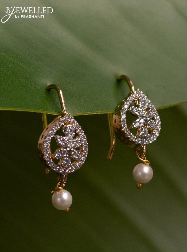 Bugadi earrings with cz stones and pearl hanging in gold finish