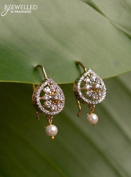 Bugadi earrings with cz stones and pearl hanging in gold finish