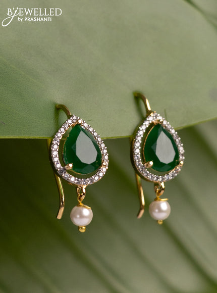 Bugadi earrings with emerald & cz stones and pearl hanging in gold finish