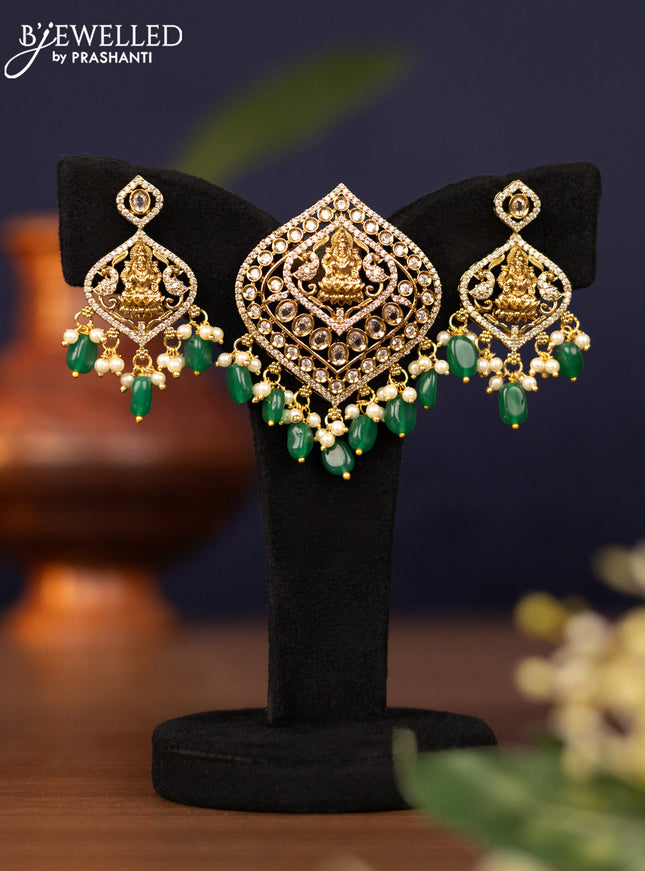 Pendant set lakshmi design with cz stones and pearl & green beads hangings in victorian finish
