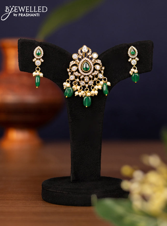 Pendant set with emerald & cz stones and pearl & beads hangings in victorian finish