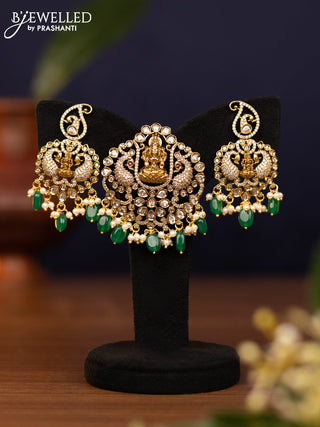 Pendant set lakshmi design with cz stones and pearl & green beads hangings in victorian finish