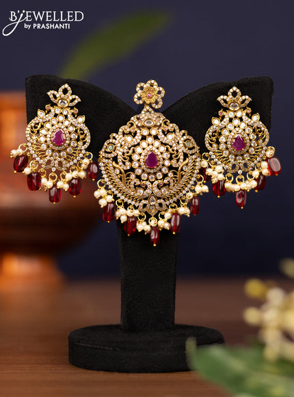 Pendant set with kemp & cz stones and pearl & maroon beads hangings in victorian finish