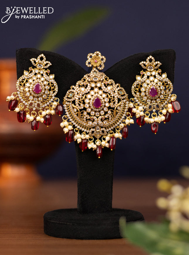 Pendant set with kemp & cz stones and pearl & maroon beads hangings in victorian finish
