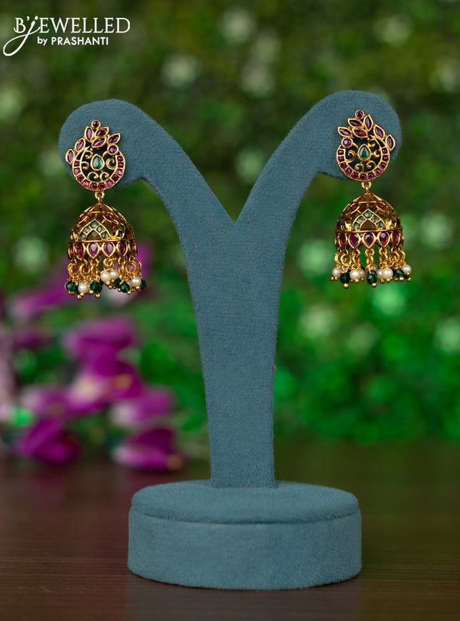 Antique jhumkas peacock desgin with kemp stones and pearl & green beads hangings