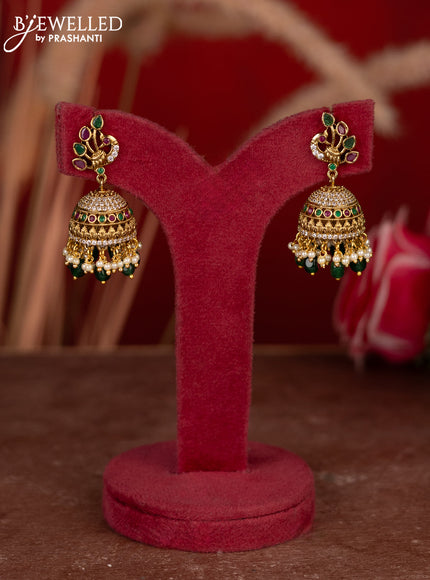 Antique jhumkas peacock desgin with kemp & cz stones and pearl & green beads hangings