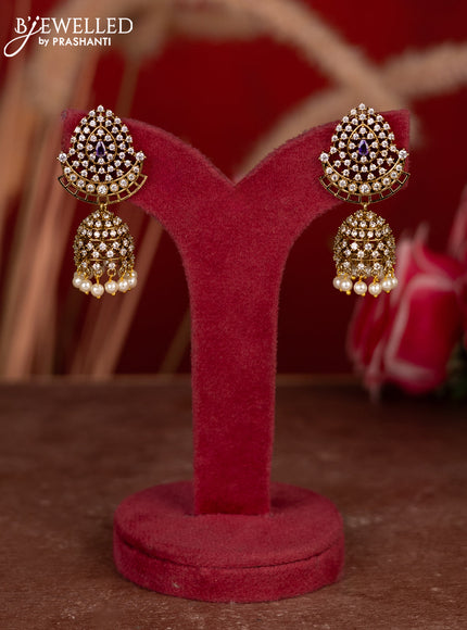 Antique jhumkas with violet & cz stones and pearl hangings