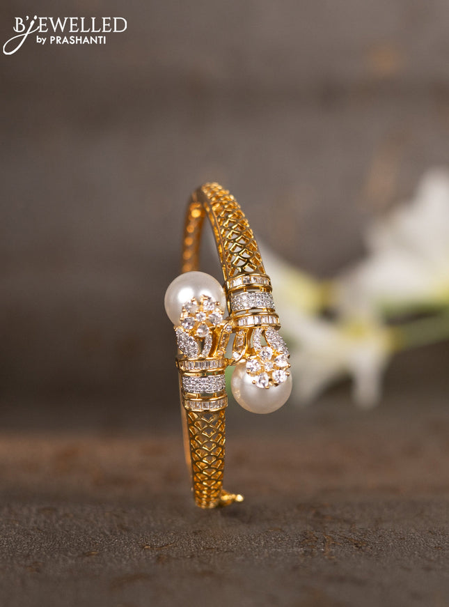 Bracelets with cz stones and pearls in gold finish