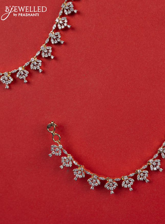 Zircon maatal with cz stones in gold finish