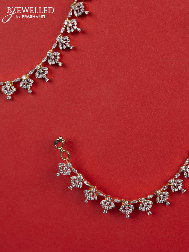 Zircon maatal with cz stones in gold finish