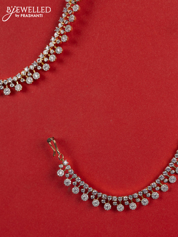 Zircon maatal with cz stones in gold finish