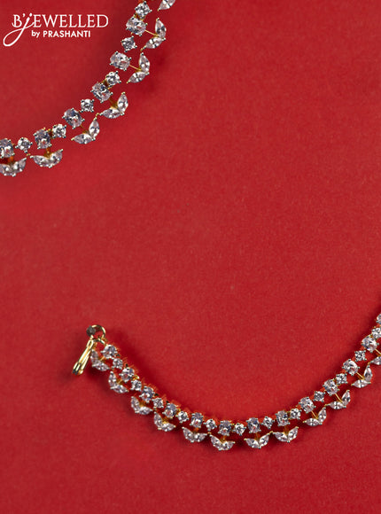 Zircon maatal with cz stones in gold finish