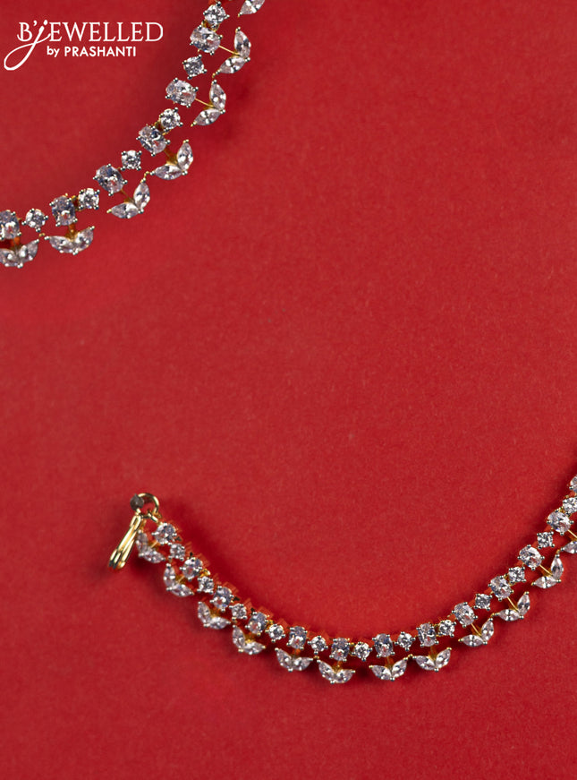 Zircon maatal with cz stones in gold finish