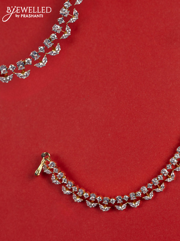 Zircon maatal with cz stones in gold finish
